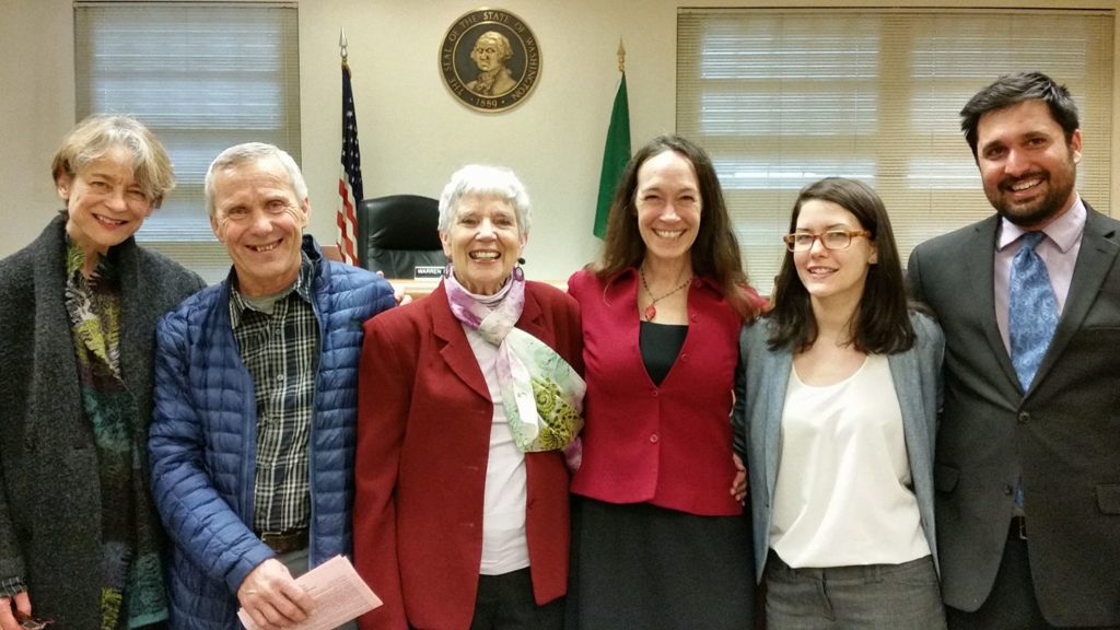 Activists pose together with state reps in Olympia Washington